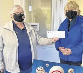  ?? CONTRIBUTE­D ?? Lion Barbara Urquhart, with the Truro & District Lions Club, left, presents a cheque for $2,000 to Colchester Food Bank coordinato­r Darlene DeAdder.