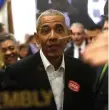  ??  ?? People rush the doors of the jury assembly room as former US president Barack Obama arrives in the Daley Centre in Chicago