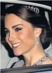  ??  ?? The Duchess of Cambridge arrives at last night’s state banquet. Earlier, Queen Letizia, left, was welcomed to Britain by the Duke of Edinburgh