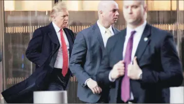  ?? AP ?? US President-elect Donald Trump leaves after a meeting at the One World Trade Centre in New York on Friday.