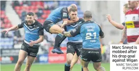  ?? MARC TAYLOR/ RLPIX.COM ?? Marc Sneyd is mobbed after his drop goal against Wigan