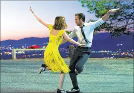  ?? DALE ROBINETTE / LIONSGATE / TNS ?? Emma Stone as Mia and Ryan Gosling as Sebastian in a scene from the musical “La La Land,” which was nominated for a record-tying 14 Oscars, including Best Picture, Best Actor (Gosling), Best Actress (Stone) and two entries in the best Original Song...