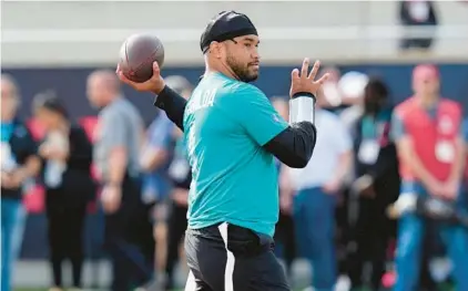  ?? CHRIS O’MEARA/AP ?? Dolphins quarterbac­k Tua Tagovailoa throws during the flag football event at the NFL Pro Bowl on Feb. 4 in Orlando. He threw his charity event, Luau with Tua, on Thursday night at Seminole Hard Rock Hotel & Casino.