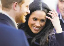  ?? Christophe­r Furlong / Getty Images ?? Prince Harry and Meghan Markle visit Nottingham, England, on Friday. The two will marry at Windsor Castle in May 2018.