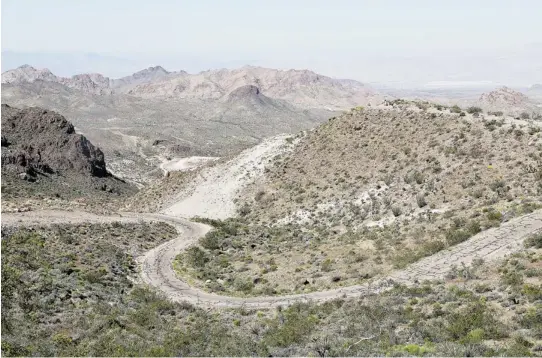  ?? PHOTOS: LYNN FARRELL/ THE GAZETTE ?? Route 66 twists through the Black Mountains between Oatman and Kingman in Arizona. This stretch of the old road was bypassed early in the 1950s.