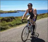  ??  ?? Adrian McCarthy from Killarney, cycling along the coast of Valentia Island