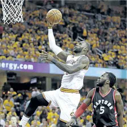  ?? TONY DEJAK/THE ASSOCIATED PRESS ?? Cleveland Cavaliers’ forward LeBron James drives past Toronto Raptors’ DeMarre Carroll in the first half in Game 1 of a second-round NBA basketball playoff series, in Cleveland. The Cavs won the game 116-105, and took a 1-0 series lead.