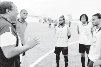  ?? ?? Head-coach Jamaal Shabazz (left) delivering instructio­ns to several of his charges during a practice session held at the National Training Centre, Providence