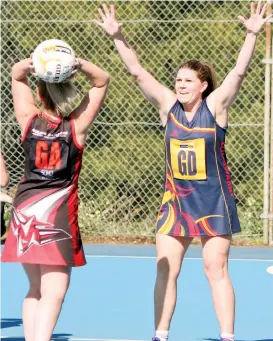  ??  ?? Longwarry goal defence Rebecca Gay puts the pressure on Nilma Darnum goal attack Kelly Kahan in Saturday’s C grade final.