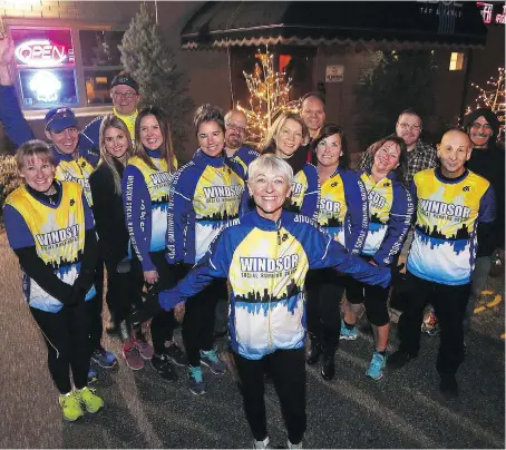  ?? DAN JANISSE ?? Lorelei Norman, front, and other members of the Social Running Group join together at one of their weekly get-togethers. Industry experts say runners and weekend warriors are always looking for the next best thing, which means races have to continuall­y...