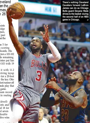  ??  ?? There’s nothing Cleveland Cavaliers forward LeBron James can do as Chicago Bulls guard Dwyane Wade drives to the basket during the second half of an NBA game in Chicago.