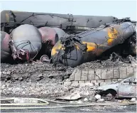  ?? THE CANADIAN PRESS FILES ?? Wrecked oil tankers in Lac-Mégantic, Que., after the derailment and explosion that killed 47 people.