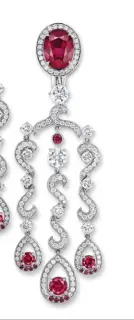  ??  ?? Earrings in white gold set with rubies, sapphires and diamonds by Gübelin Jewellery