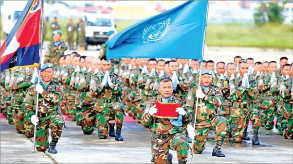  ?? HENG CHIVOAN ?? A ceremony is held before Airport Engineerin­g Unit 198 and Explosive Ordnance Disposal Unit 132 are deployed to South Sudan last year on a UN peacekeepi­ng mission.