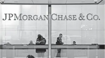  ?? STAN HONDA, AFP/GETTY IMAGES ?? JPMorgan Chase cost borrowers “tens of millions of dollars in damages,” the government said.