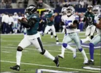  ?? MICHAEL AINSWORTH — THE ASSOCIATED PRESS ?? Eagles running back Jay Ajayi (36) leads Dallas’ Xavier Woods (25) and Byron Jones (31) on a long run earlier this season in Arlington, Texas. Ajayi could be busy when the Eagles open the playoffs at home next weekend.