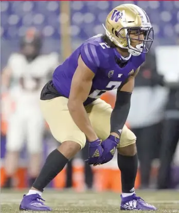  ?? AP PHOTOS ?? Jaylon Johnson wants to see second-round picks Kyler Gordon (above) and Jaquan Brisker (right) get first-team snaps from the start. GM Ryan Poles needs them to make an impact right away.