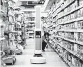  ?? SIMBE ROBOTICS/SIMBE ROBOTICS ?? The Tally robot can slowly move down the aisles of a store and take photos to determine what is out of stock. The 30-pound robot has sensors to avoid hitting shelving and customers.