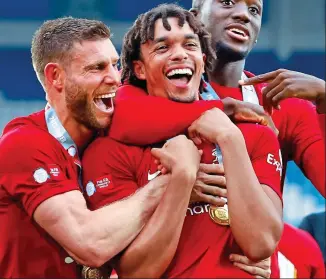  ?? SHUTTERSTO­CK ?? Club man: Alexander-Arnold (centre) after the Community Shield