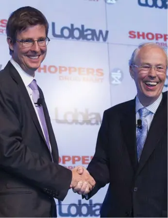  ?? MICHELLE SIU/THE CANADIAN PRESS FILE PHOTO ?? Galen Weston Jr., left, the executive chairman of Loblaw, and Holger Kluge, chairman of Shoppers Drug Mart, announce the grocer’s purchase of the drug store chain in July. Sobeys has also announced plans to merge with Safeway. Increased competitio­n has...