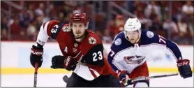  ??  ?? Jan. 25 file photo, Arizona Coyotes defenseman Oliver Ekman-Larsson (23) and Columbus Blue Jackets right wing Josh Anderson (77) skate to the puck during the first period of an NHL hockey game, in Glendale, Ariz. AP Photo/RoSS D. FRAnklIn,