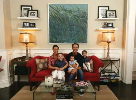  ?? STEVE RUSSELL PHOTOS/TORONTO STAR ?? Ben Mulroney with wife Jessica and kids, John, 4, Ivy, 1, and Brian, 4 (the boys are twins). The artwork behind them was painted by Ben’s mother.