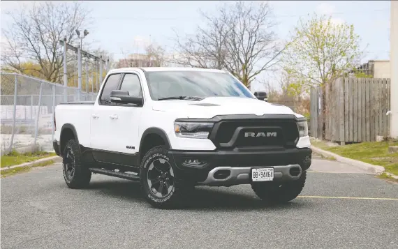  ?? PHOTOS: CLAYTON SEAMS ?? With its white-letter all-terrain tires and a great looking blacked-out grill reminiscen­t of a Fu Manchu moustache, the 2020 Ram 1500 Rebel just looks cool.