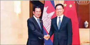  ?? FACEBOOK ?? Prime Minister Hun Sen shakes hands with China’s First Vice-Premier Han Zheng at the China-Asean Expo in Nanning last week.