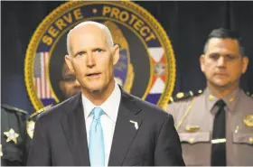  ?? Bob Self / Associated Press ?? Florida Governor Rick Scott has received top marks from the NRA in the past for supporting gun-rights measures, but he does not support arming teachers.