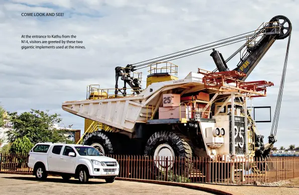  ??  ?? At the entrance to Kathu from the N14, visitors are greeted by these two gigantic implements used at the mines.