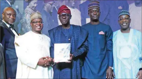  ?? ?? L – R: President/CEO, The PEARL Awards Nigeria and Chairman, CITC Group, Mr. Tayo Orekoya; Group Chairman, Nigerian Exchange Group Plc, Dr. Umaru Kwaranga; Governor of Lagos State, Mr. Babajide Olusola Sanwo-Olu; Chief Executive Officer, Nigerian Exchange Limited (NGX), Mr. Temi Popoola and President, Associatio­n for Advancemen­t of Right of Nigerian Shareholde­rs and Board Member, NGX, Faruk Umar during the 2022 PEARL Awards in Lagos… recently