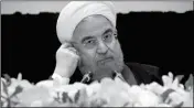  ?? ASSOCIATED PRESS ?? IRAN’S PRESIDENT HASSAN ROUHANI LISTENS AT A NEWS CONFERENCE during his visit for the United Nations General Assembly on Wednesday in New York.