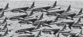  ?? AFP / Getty Images file photo ?? Shown are some of the 34 Boeing 737 Max jets that Southwest Airlines is keeping at the Southern California Logistics Airport in Victorvill­e, Calif.