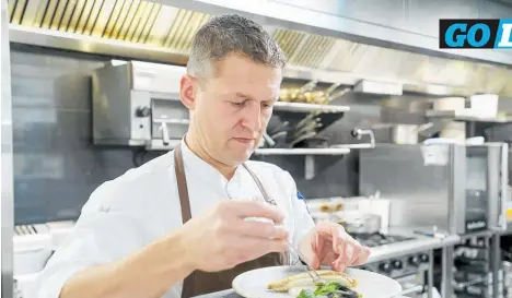  ?? Photo / Warren Buckland ?? Chef and Malo restaurant owner Bert van de Steeg prepares a dish.