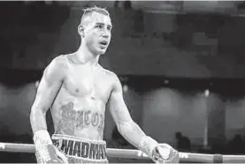  ?? SCOTT TAETSCH/GETTY ?? Maxim Dadashev returns to his corner after the 10th round of his fight against Subriel Matias on Friday in Oxon Hill.