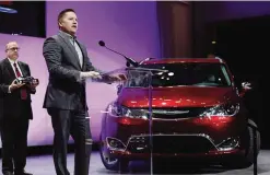  ?? —AP ?? DETROIT: Fiat Chrysler representa­tive Tim Kuniskis addresses the media after the Pacifica minivan from Fiat Chrysler won utility vehicle of the year at the North American Internatio­nal Auto show yesterday.