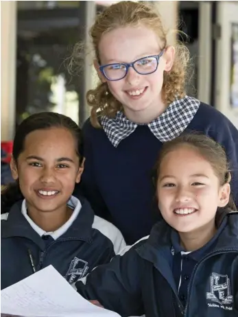  ?? PHOTO: KEVIN FARMER ?? WORKING HARD: Toowoomba East State School students (from left) Sophie Khan, Abigail Leslight and Ashlynn Austin are proud of their school’s high results in NAPLAN.