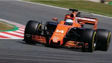  ?? Associated Press ?? McLaren driver Fernando Alonso of Spain steers his car Saturday during the qualifying session for the Spanish Formula One Grand Prix at the Barcelona Catalunya racetrack in Montmelo, Spain. The Spanish Formula One Grand Prix will take place today.