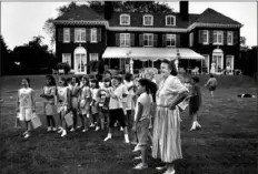  ?? Robin Rombach/Pittsburgh Press ?? Elsie Hillman hosts her granddaugh­ter's 10th birthday party on the lawn behind the Hillmans’ Squirrel Hill home in 1990.