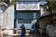  ?? BERNAT ARMANGUE / AP ?? An Afghan man walks past the former Women’s Affairs Ministry building in Kabul, Afghanista­n, on Saturday.