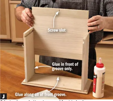  ??  ?? J Glue along all of front groove.
Orient a drawer bottom to expand front to back. Apply glue in the groove in the drawer front, and the front 2" in the sides. Cut a slot for a screw to secure the rear to the bottom of the drawer back.