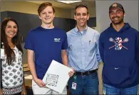  ?? CONTRIBUTE­D ?? Garrett Schmitt raised thousands of dollars for young cancer patients. Pictured from left are social worker Caren Heilman, Schmitt; Dr. Phil Neff; and Cedar Ridge High assistant lacrosse coach Donnie Murray.