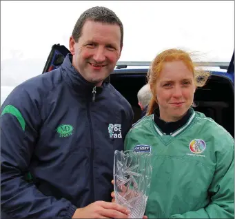  ??  ?? Patrice Diggins (Cillard Camogie club) winner of the Senior Camogie Puc Fada, been presented with the Trophy by the Puc Fada Ambassador Brendan Cummins Photo by Paddy White