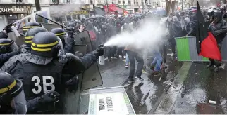  ??  ?? French CRS riot police use tear gas against French high school and university students, Paris, in this file photo. (Reuters)