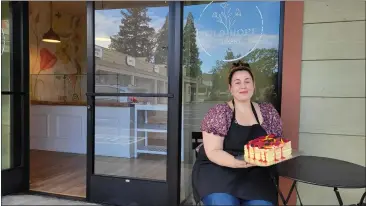  ?? COURTESY PHOTO ?? Last year's 5th prize winner, Ashely Ruth Garrigus, stands outside of her new storefront. The grand opening of her business, Wild Hope Bakery is today in Middletown.