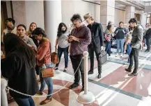  ?? Ricardo B. Brazziell / Austin American-Statesman via AP ?? People wait in line to attend the “sanctuary cities” meeting at the Texas State Capitol in Austin on Wednesday. Over 600 registered opposition to the bill while 11 planned to voice support.