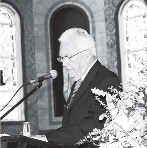  ??  ?? Charles Johnston, member of the managing committee of the Shipping Associatio­n of Jamaica, delivering a message on behalf of the shipping and logistics industry at the funeral of Noel A. Hylton.