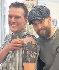  ??  ?? Mark Chorlton (left) with tattoo artist James Creighton, at Artmageddo­n in Macclesfie­ld