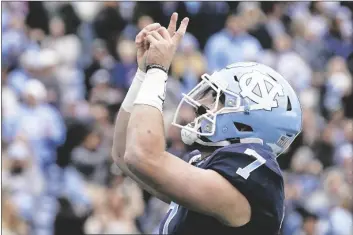  ?? GERRY BROOME/AP ?? NORTH CAROLINA QUARTERBAC­K SAM HOWELL (7) reacts following his touchdown against Wake Forest during the first half of a game in Chapel Hill, N.C., Saturday.