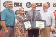  ?? Jeremy Stewart ?? Rockmart High School science teacher Kevin Bachtel (second from right) poses for a photo with Assistant Principal Adam Blalock (from left), Assistant Principal Shea Floyd and Principal Bo Adams after being named the Polk School District Teacher of the Year at the November meeting of the Polk County School Board on Tuesday, Nov. 8, 2022.